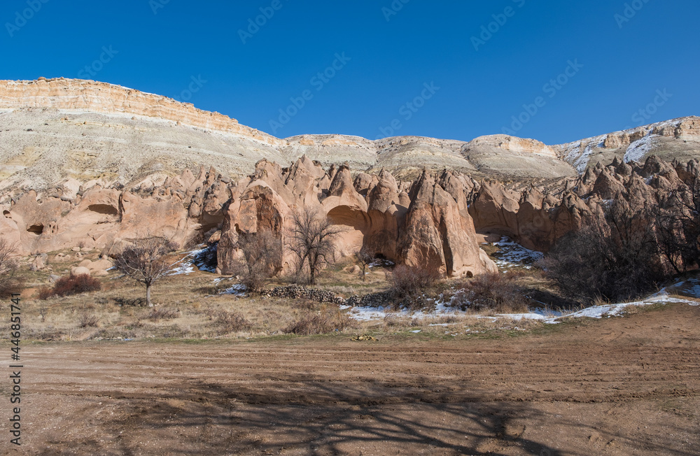 Fairy chimneys (rock formations) at Cappadocia Turkey - nature background. February 2021