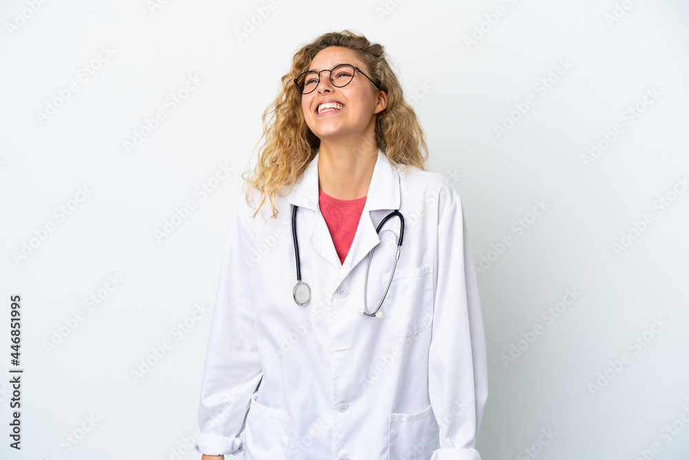 Young doctor blonde woman isolated on white background laughing Young doctor blonde woman isolated on white background laughing