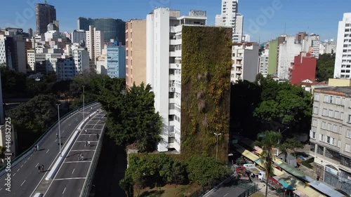 Aerial view of a big vertical green wall on a residential building next to the Minhocao overpass, in Sao Paulo, Brazil.