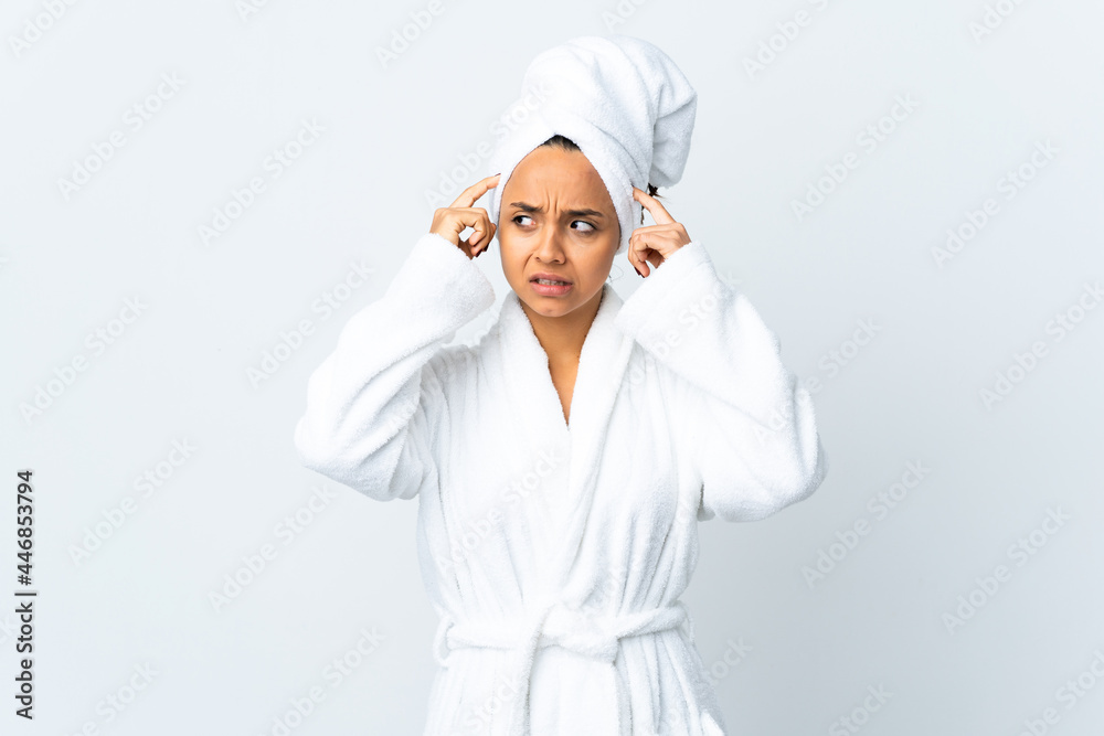 Young woman in bathrobe over isolated white background having doubts and thinking Young woman in bathrobe over isolated white background having doubts and thinking