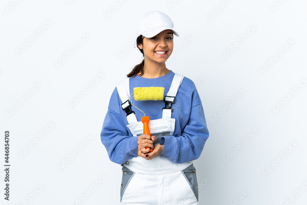 Painter woman over isolated white background laughing Painter woman over isolated white background laughing