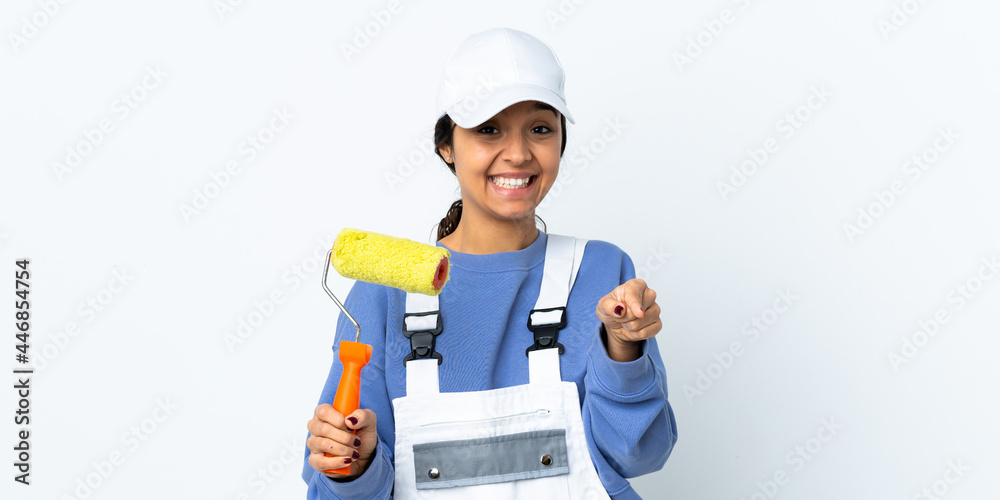 Painter woman over isolated white background surprised and pointing front Painter woman over isolated white background surprised and pointing front