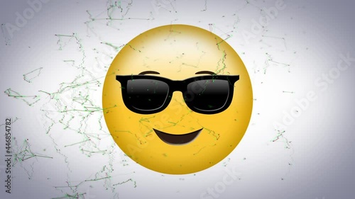 Digital animation of network of connections over face wearing sunglasses emoji on grey background photo