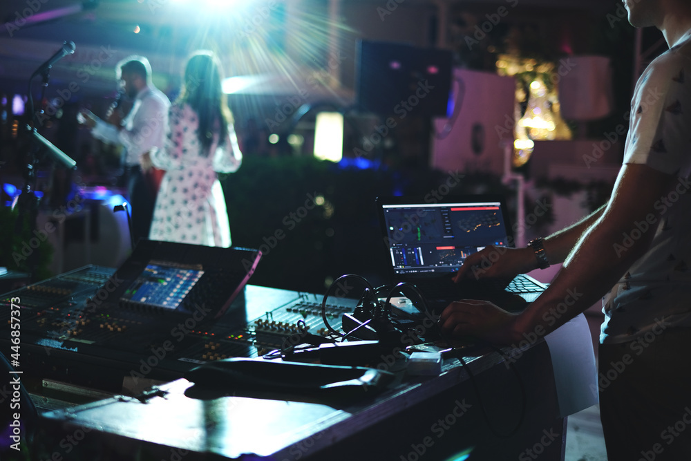 DJ plays at the party. DJ console. professional equipment for fun parties
