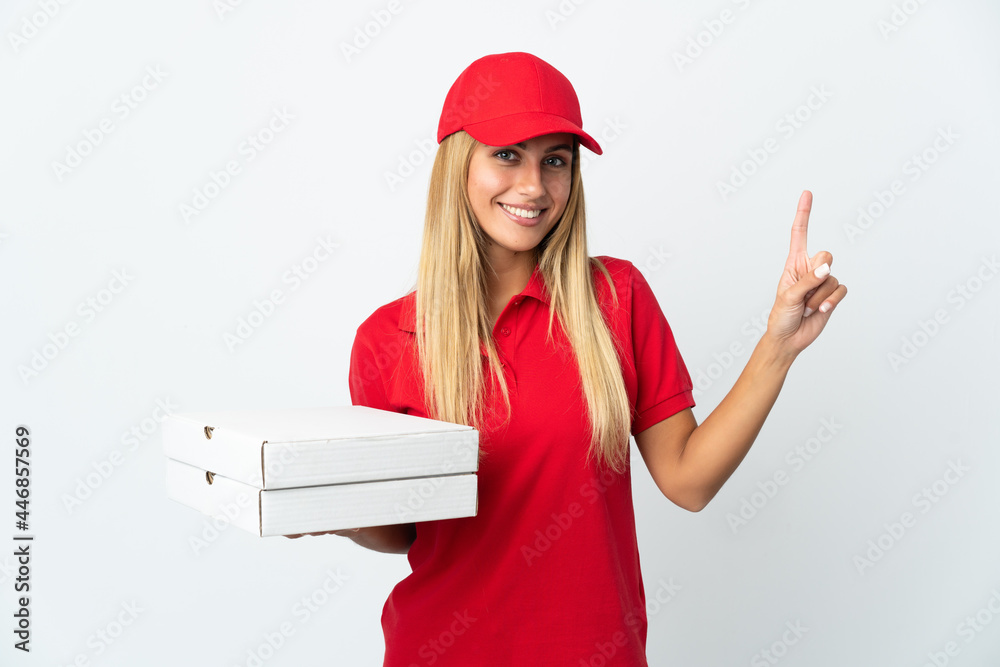 Pizza delivery woman holding a pizza isolated on white background pointing up a great idea Pizza delivery woman holding a pizza isolated on white background pointing up a great idea