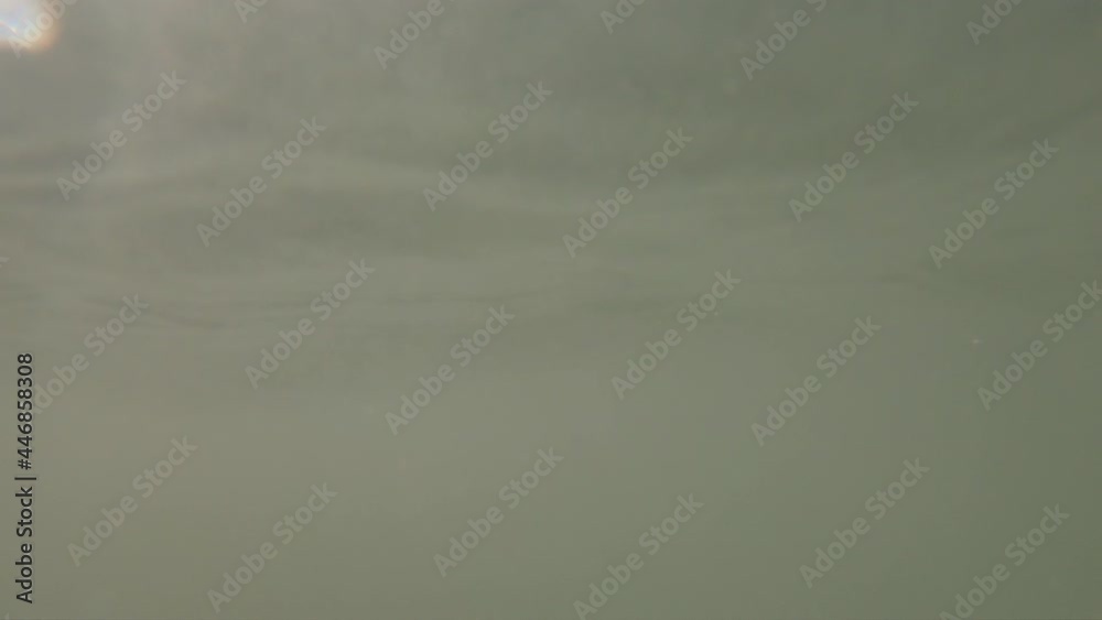 Pov drowning person floating on wea wateer surface with waves pushing him underwater Pov drowning person floating on wea wateer surface with waves pushing him underwater