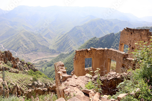 preserved wall with the window in ruined house of abandoned ancient village Gamsutl in the Dagestan, Russia

 photo