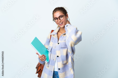 Young student woman isolated on white background laughing