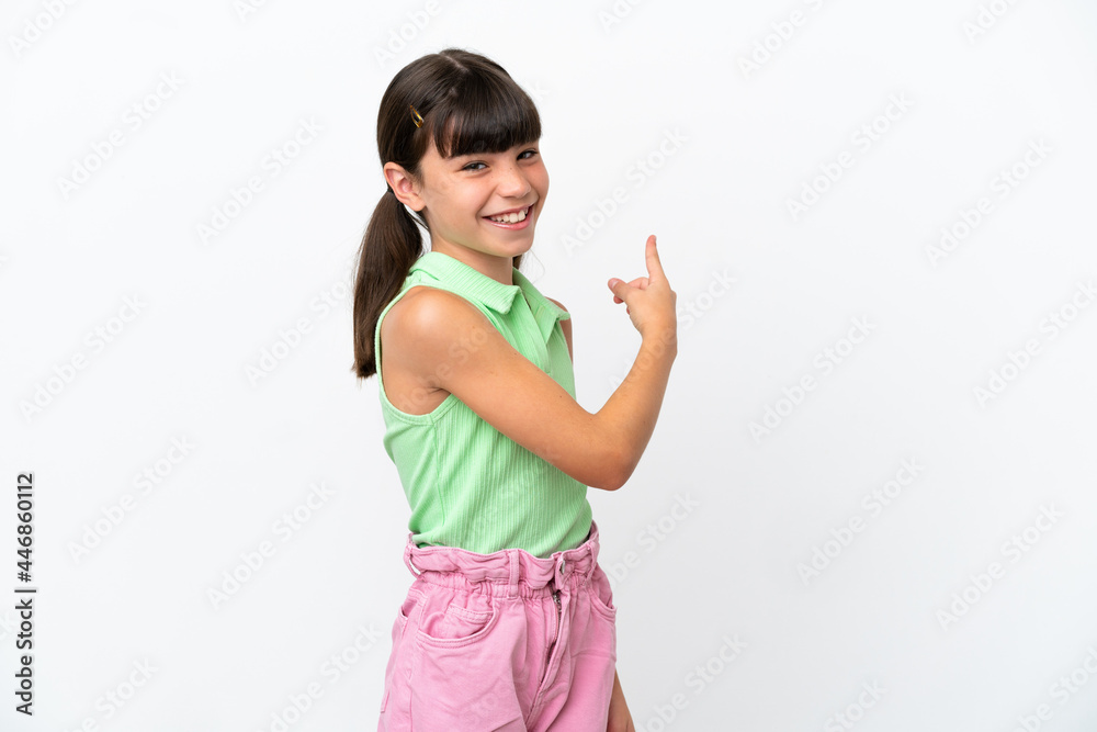 Little caucasian kid isolated on white background pointing back Little caucasian kid isolated on white background pointing back