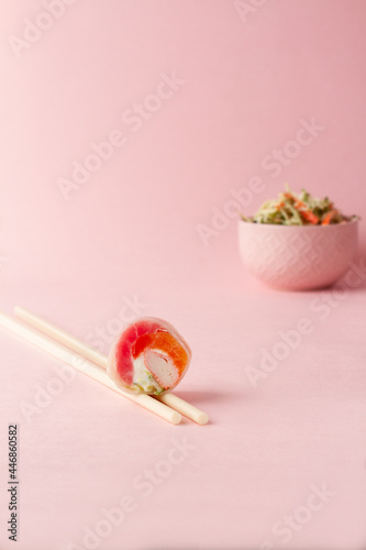 sushi, sushi salad, pink background. japanese food