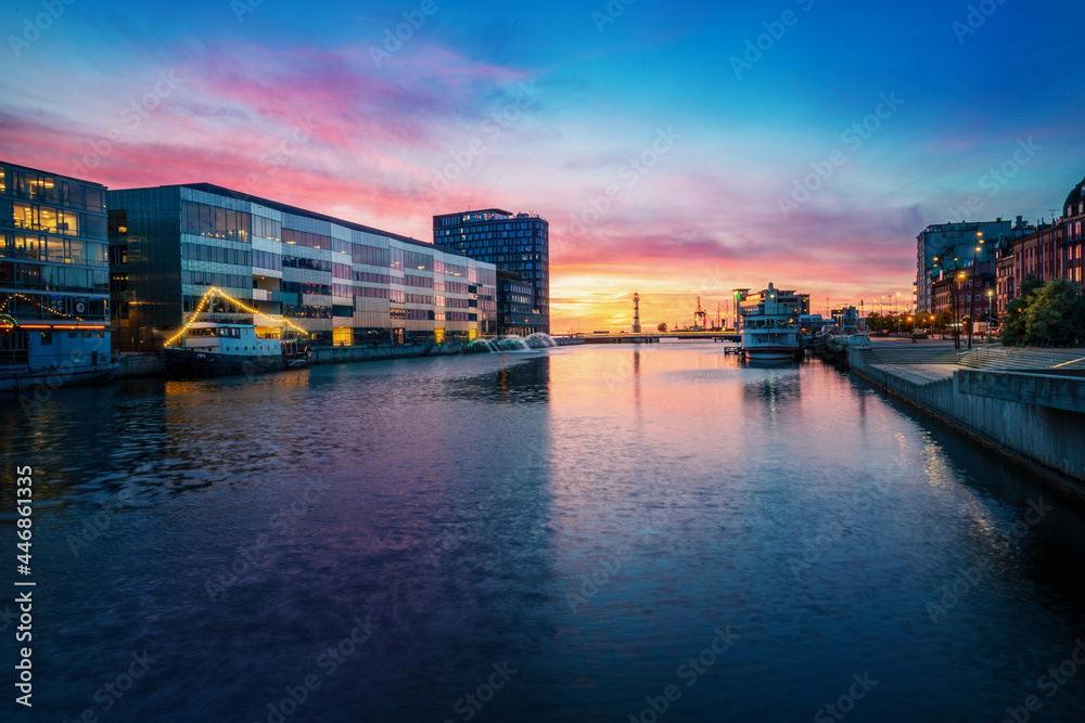 Fototapeta premium Malmo Inner Harbor with Malmo University Library building (Orkanen) at sunset - Malmo, Sweden