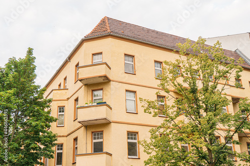 yellow apartment corner building at weissensee, berlin