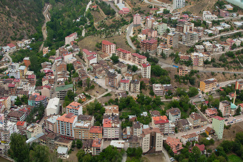 Torul, Gumushane, Turkey- June 28 2021: A view of the city center of the Torul district of Gumushane province from above. photo