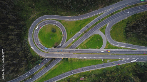 A birds eye view of  an intertwining highway in Ecuador