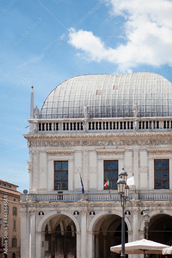 Fototapeta premium The Palazzo della Loggia is a renaissance square with a city hall (Comune di Brescia) surrounded by Venetian-style buildings located in the town in Lombardy, Italy. Historical European landmark.