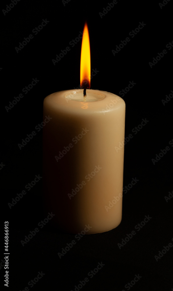 Big flame in a candle in the dark Big flame in a candle in the dark