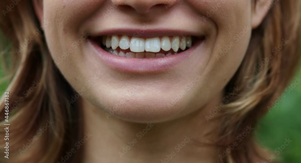 The perfect white teeth of a happy woman on a blurred background The perfect white teeth of a happy woman on a blurred background