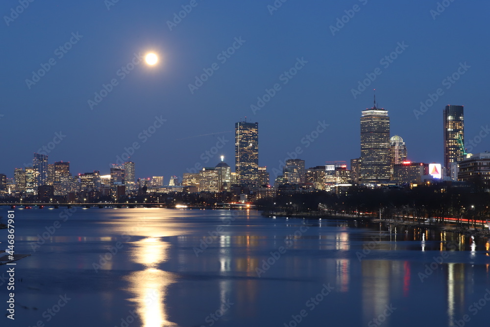 Fototapeta premium Boston Skyline At Night With Full Moon, Citgo Sign Charles River