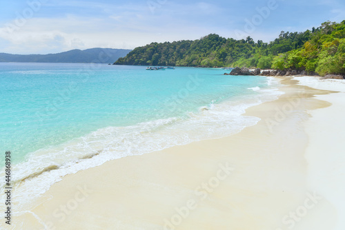 Soft blue ocean wave or clear sea on clean sandy beach summer concept