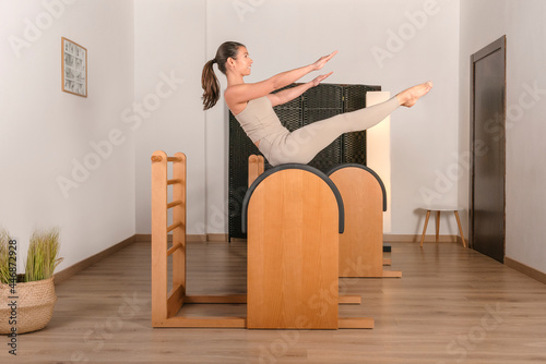 brunette girl doing pilates exercise teaser