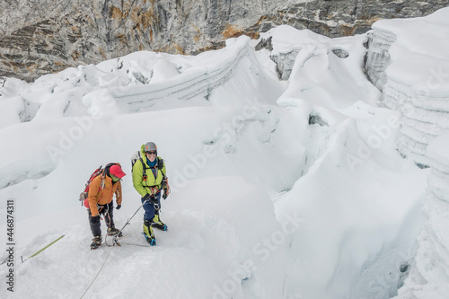 Western climber and Sherpa Guide take pause amid complicated crevasses photo