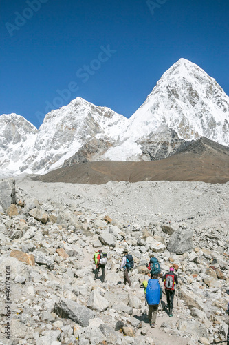 Climbing team traverses a glacial moraine, Pumori in the background photo