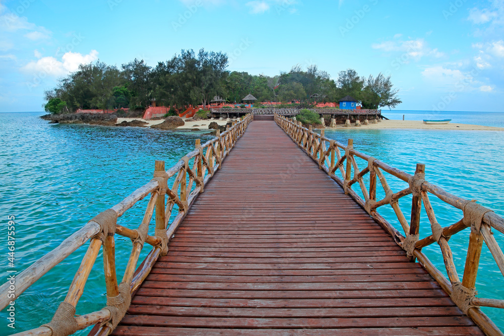 Wooden dock walkway to a small, idyllic tropical island, Zanzibar.