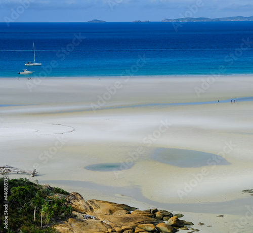 The blue sea and white sand of Whitsunday Island.