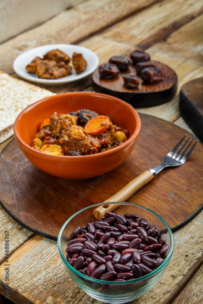 Jewish dish shuttle with meat on the table in a plate near the ingredients.