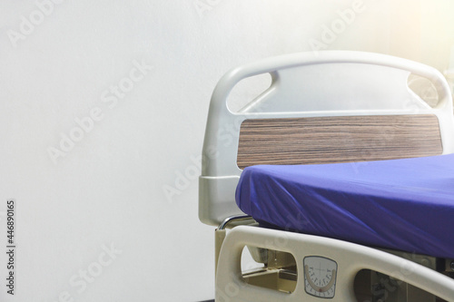 Empty modern electric hospital bed or patient's bed in hospital ward over white background, copy space