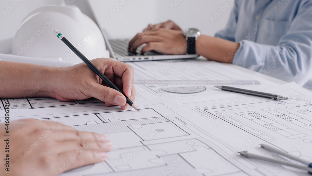 Two business man construction site engineer. Engineering tools on workplace Planning Design Draw Teamwork. Two business man construction site engineer. Engineering tools on workplace Planning Design Draw Teamwork.