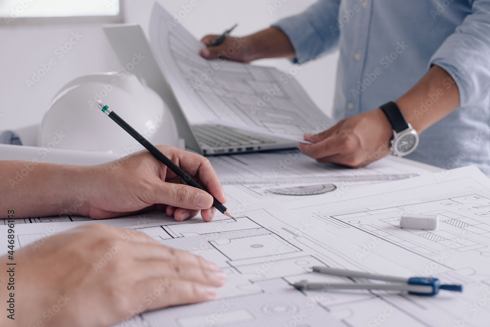 Two business man construction site engineer. Engineering tools on workplace Planning Design Draw Teamwork. Two business man construction site engineer. Engineering tools on workplace Planning Design Draw Teamwork.