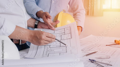 Two business man construction site engineer. Engineering tools on workplace Planning Design Draw Teamwork.