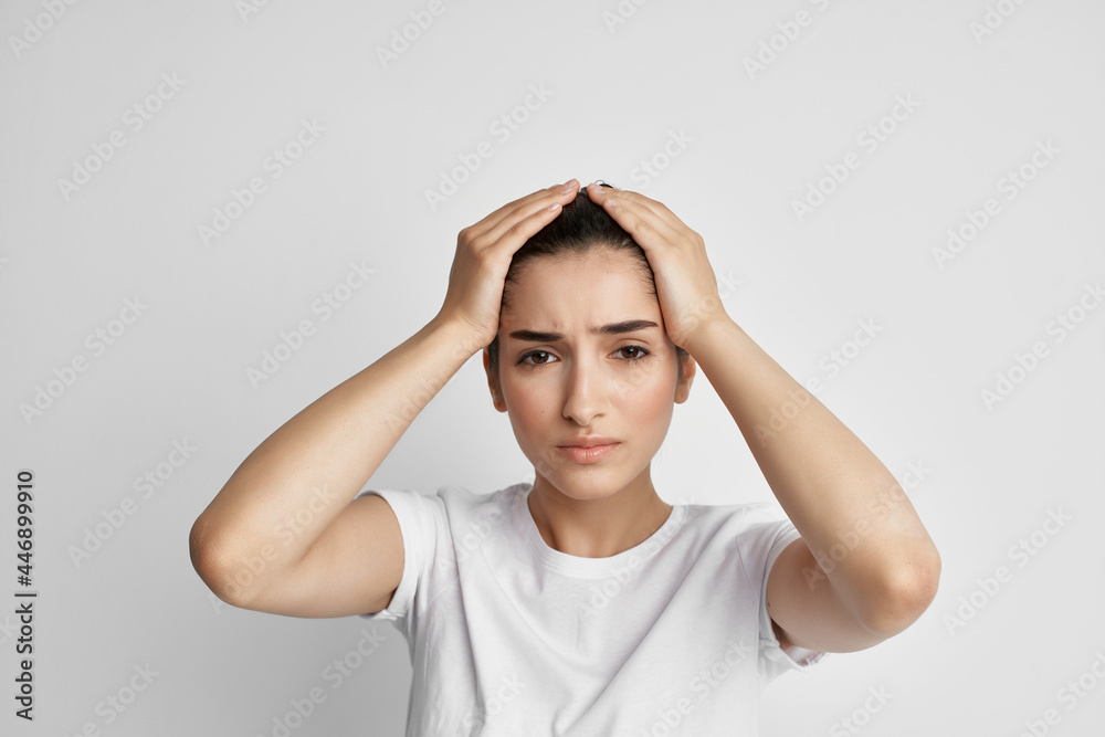 woman in white t-shirt health problems headache stress emotions woman in white t-shirt health problems headache stress emotions
