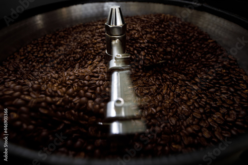  brown coffee beans in roasting spin machine
