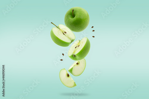 Stack of green Apple falling or flying.Creative levitation food