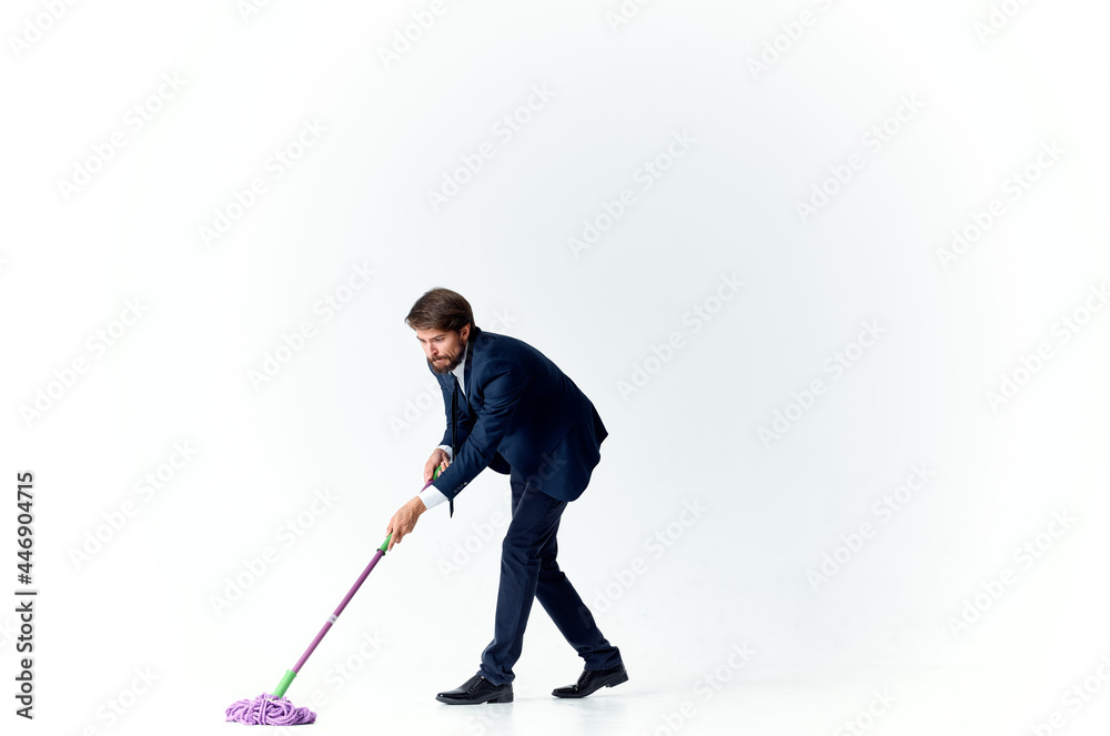 man in a suit with a mop in his hands emotions cleaning official man in a suit with a mop in his hands emotions cleaning official