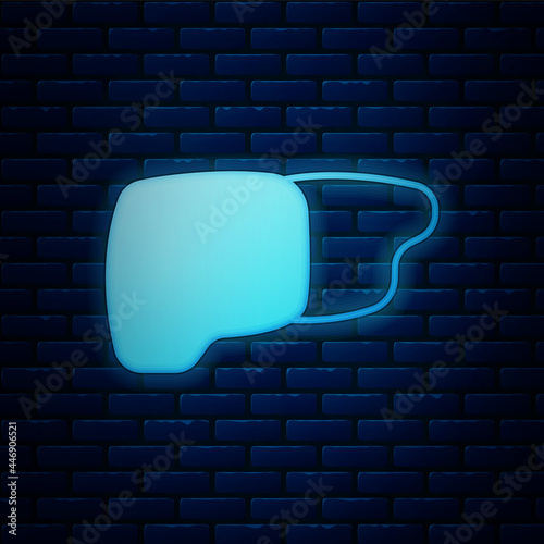 Glowing neon Human organ liver icon isolated on brick wall background. Vector