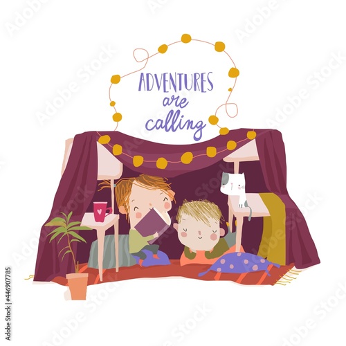 Cute Children sitting and reading a Book in a Homemade Teepee