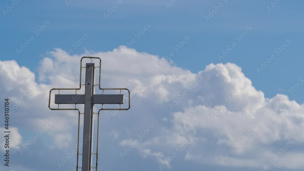 timelapse cross on clouds. heavenly pastel sky fluffy clouds background. slow motion of cloudy sky in sunset time. Faith and belief of Christianity symbol. the clear atmosphere in summer season. timelapse cross on clouds. heavenly pastel sky fluffy clouds background. slow motion of cloudy sky in sunset time. Faith and belief of Christianity symbol. the clear atmosphere in summer season.