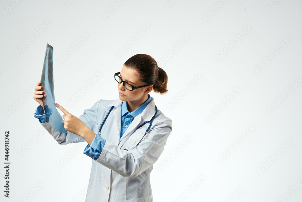 woman doctor radiologist x-rays examination hospital light background woman doctor radiologist x-rays examination hospital light background