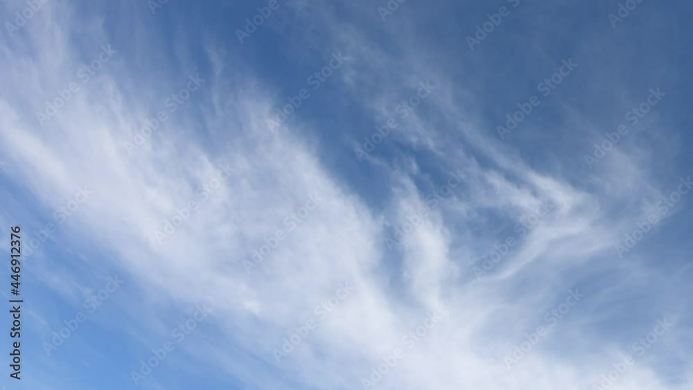 Thin cirrus clouds in the blue sky, time-lapse. Cloudy sky video.
