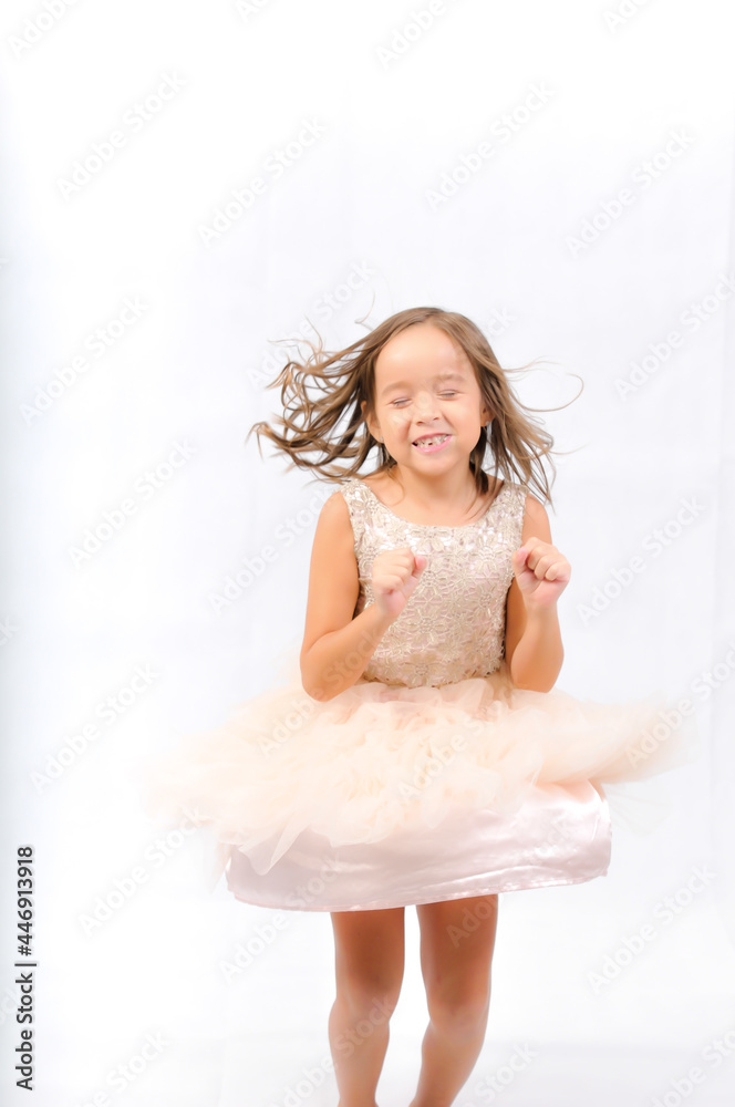 Portrait of happy pretty curly little girl standing and posing over white background Portrait of happy pretty curly little girl standing and posing over white background