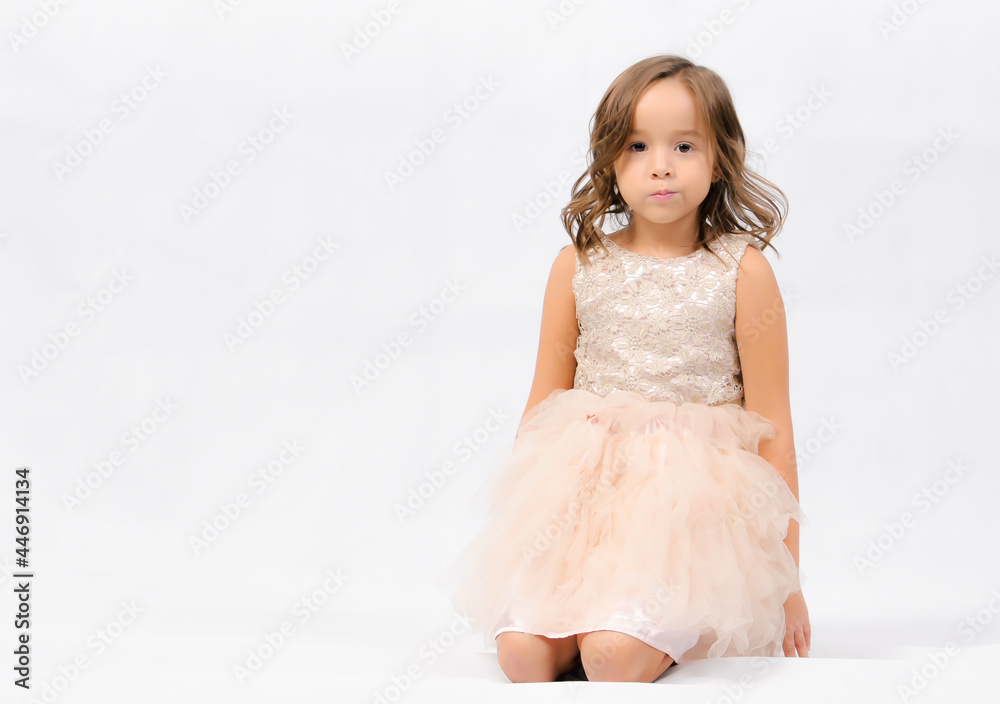 Portrait of happy pretty curly little girl standing and posing over white background Portrait of happy pretty curly little girl standing and posing over white background