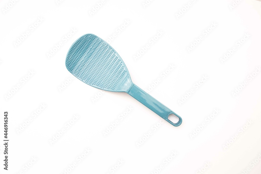 plastic rice paddle spoon isolated on a white background plastic rice paddle spoon isolated on a white background