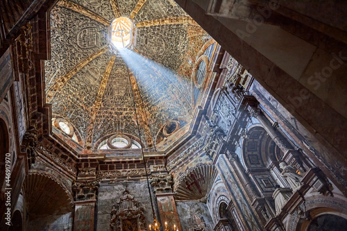 Photos a ray of sunlight enters through the  dome of the chapel of El Pilar in the cath