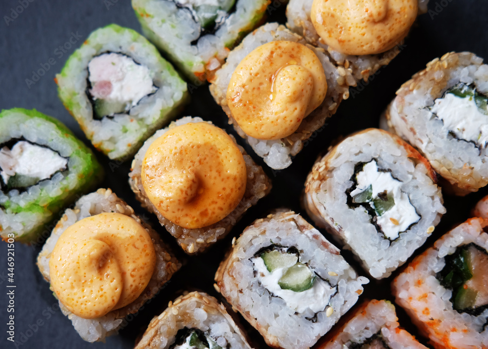 Overhead japanese sushi food. Maki ands rolls with tuna, salmon, shrimp, crab and avocado. Overhead japanese sushi food. Maki ands rolls with tuna, salmon, shrimp, crab and avocado.