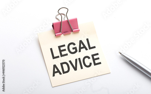 LEGAL ADVICE text on the sticker with pen on the white background