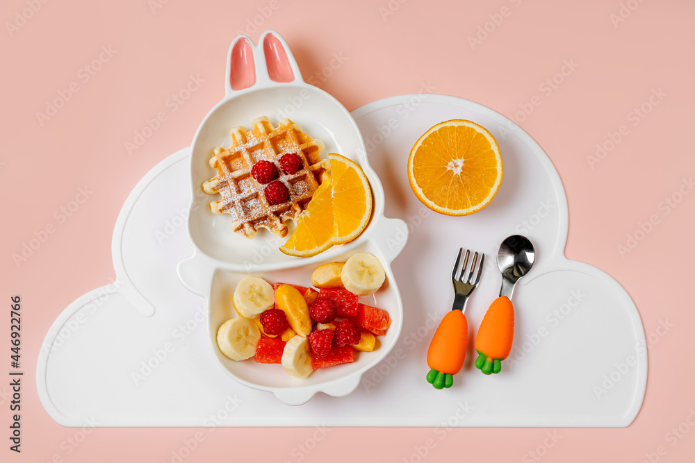 Children's Breakfast. Cute plate in the shape of a bunny with waffles and fruits. Food idea for kids. Children's Breakfast. Cute plate in the shape of a bunny with waffles and fruits. Food idea for kids.