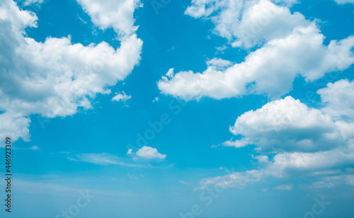 aerial view fluffy white clouds in blue sky. cumulus cloudscape nature background good weather in bright summer day. copy space of natural color and light in heaven. clear sunny weather forecasting